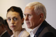 U.S. Vice President Mike Pence, right, talks beside New Zealand Prime Minister Jacinda Ardern during the Leaders Electrification Project meeting as part of the APEC 2018 at Port Moresby, Papua New Guinea on Sunday, Nov. 18, 2018. In a statement issued to media, Papua New Guinea has invited Australia, Japan, New Zealand and the United States to work together to support its enhanced connectivity and the goal of connecting 70% of its population to electricity by 2030. Currently only about 13% of Papua New Guinea's population have reliable access to electricity. (AP Photo/Aaron Favila)
