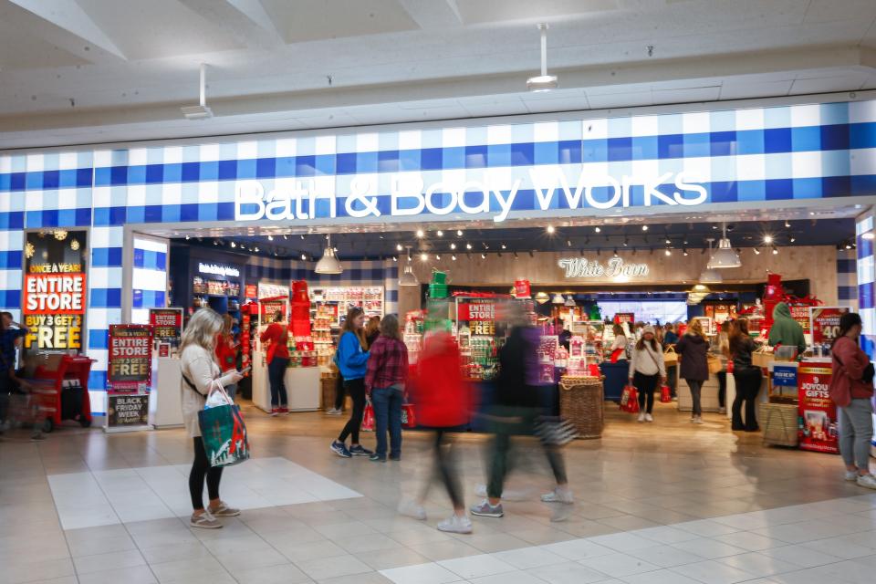 Shoppers bustle past Bath & Body Works on Black Friday at Battlefield Mall on Friday, Nov. 25, 2022. The mall opened at 6 a.m. and about 100 shoppers were waiting outside in anticipation.