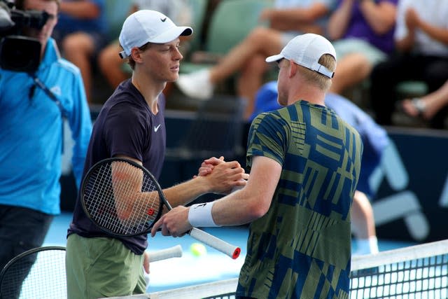 Kyle Edmund (right) shakes hands with Jannik Sinner