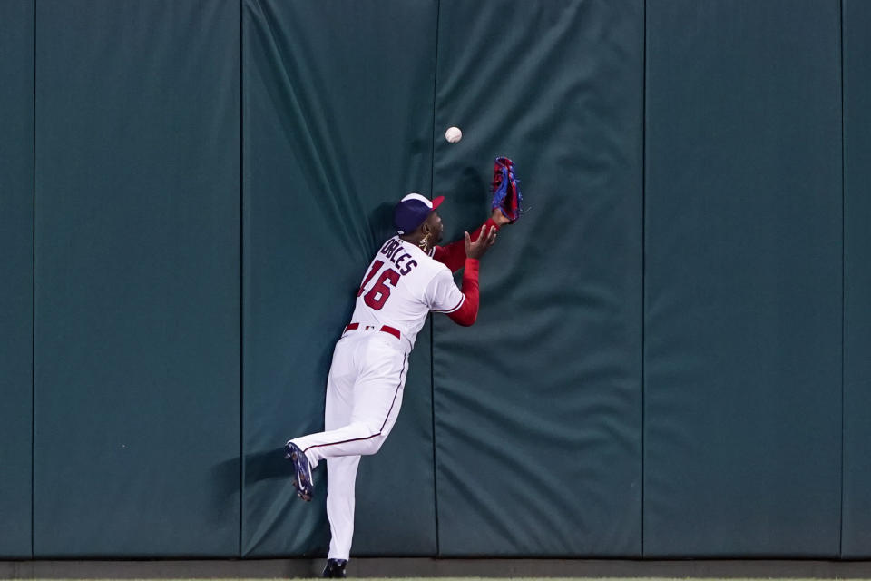 Washington Nationals center fielder Victor Robles can't catch the ball hit by Arizona Diamondbacks' Pavin Smith for a double during the fourth inning in the second game of a baseball doubleheader at Nationals Park, Tuesday, April 19, 2022, in Washington. (AP Photo/Alex Brandon)