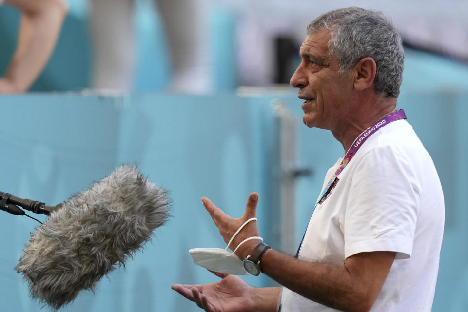 Portugal's manager Fernando Santos gestures during an interview prior to a team training session at the football arena stadium in Munich, Friday, June 18, 2021 the day before the Euro 2020 soccer championship group F match between Portugal and Germany. (AP Photo/Matthias Schrader)