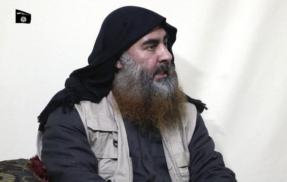 This image made from video posted on a militant website on Monday, April 29, 2019, purports to show the leader of the Islamic State group, Abu Bakr al-Baghdadi, being interviewed by his group's Al-Furqan media outlet. Al-Baghdadi acknowledged in his first video since June 2014 that IS lost the war in the eastern Syrian village of Baghouz that was captured last month by the Kurdish-led Syrian Democratic Forces. (Al-Furqan media via AP)