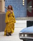 <p>The now-iconic Roberto Cavalli off-the-shoulder yellow dress Beyoncé wore while smashing car windows in the "Hold Up" music video may be interpreted as a reference to the African goddess Oshun, the mother of fresh water who is historically depicted in yellow. Quite fittingly, the opening visual of the music video shows Beyoncé submerged in water. Later in the video, she emerges from a building in a flood of water, still wearing the layered yellow dress.</p>