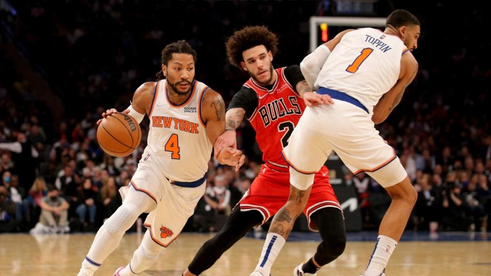 December 2, 2021;  New York, New York, United States;  New York Knicks forward Obi Toppin (1) lays down a pick as guard Derrick Rose (4) drives around Chicago Bulls guard Lonzo Ball (2) during the first quarter at Madison Square Garden.  Mandatory Credit: Brad Penner - USA TODAY Sports