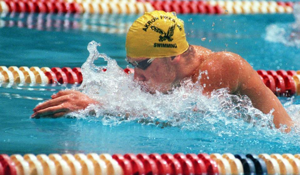 Mark Gangloff competes in the Division I district swim meet in the 100-yard breaststroke at Cleveland State University's Busbey Natatorium during his time at Firestone High School. Gangloff won the race and was a standout at Firestone from 1996-2000.