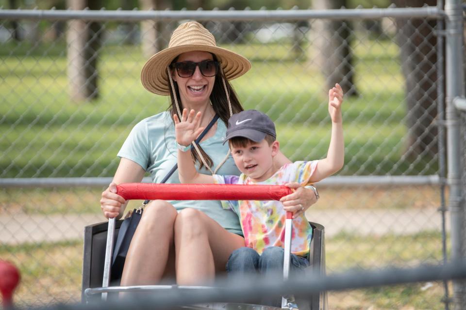 Nicole Sanock and her son Harrison Sanok, 5, smile and cheer at the Rides at City Park on Saturday, June 8, 2024.