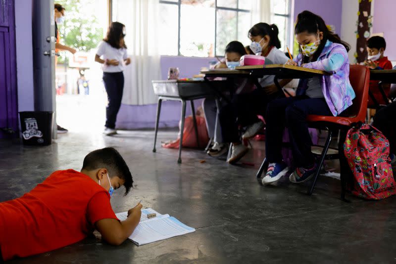 Students wearing protective masks attend a class in person as the coronavirus disease (COVID-19) outbreak continues, in Ciudad Juarez