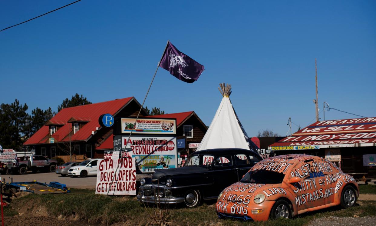 <span>Signs and flags are seen on the property of William Denby, Ontario, Canada, last month.</span><span>Photograph: Cole Burston/For The Guardian</span>