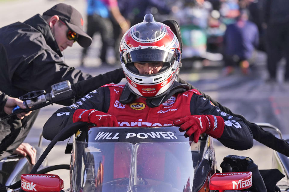 Will Power of Australia starts to exit his car during an IndyCar auto race practice at Texas Motor Speedway in Fort Worth, Texas, Saturday, April 1, 2023. (AP Photo/LM Otero)