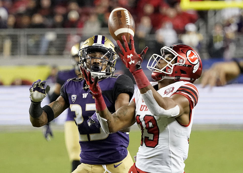 Utah wide receiver Bryan Thompson (19) cannot catch a pass in front of Washington defensive back Jordan Miller (23) during the second half of the Pac-12 Conference championship NCAA college football game in Santa Clara, Calif., Friday, Nov. 30, 2018. (AP Photo/Tony Avelar)