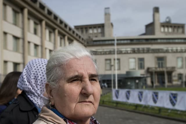 Munira Subasic, of the Mothers of Srebrenica, demonstrates outside the building which houses the International Residual Mechanism for Criminal Tribunals in The Hague, Netherlands