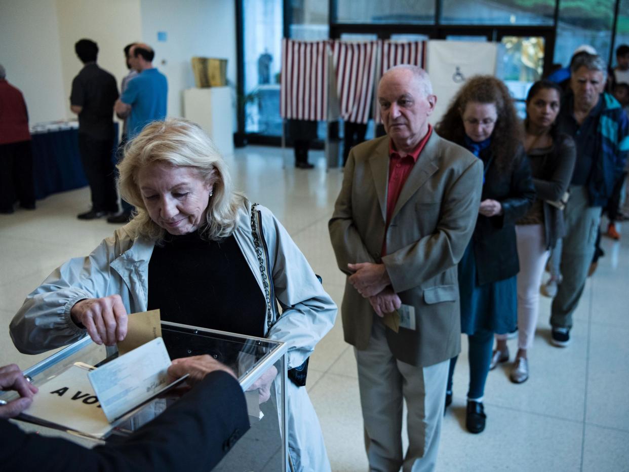 A French citizen casts her ballot at the French embassy in Washington DC: Getty Images