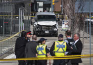 <p>Police are seen near a damaged van after a van mounted a sidewalk crashing into pedestrians in Toronto on Monday, April 23, 2018. (Photo: Aaron Vincent Elkaim/The Canadian Press via AP) </p>