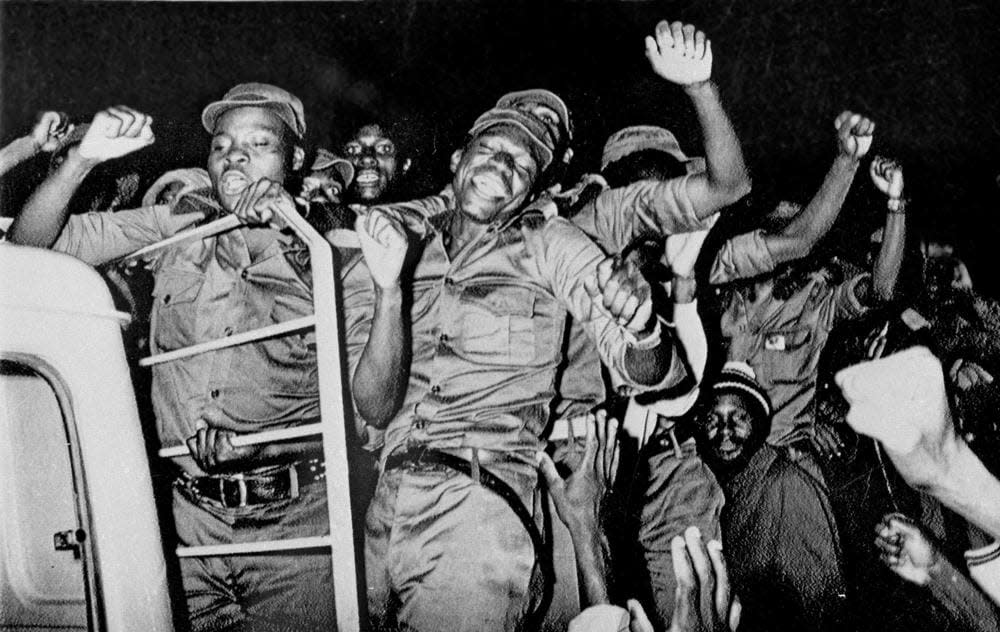 Guerrillas who fought a war for seven years rejoice as they leave the stadium in Zimbabwe’s capital Salisbury (present-day Harare), following independence celebrations marking the birth of the state of Zimbabwe on April 18, 1980. (AP Photo/Matt Franjola, File)