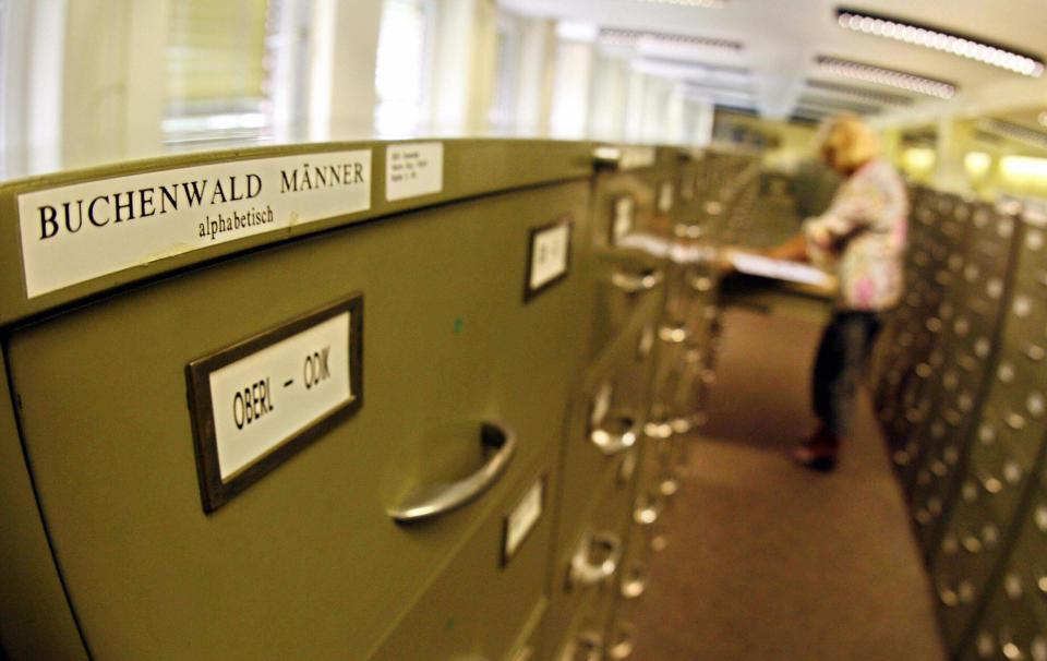 An employee of the International Tracing Service (ITS), an arm of the International Committee of the Red Cross and based in Bad Arolsen, works in a part of the ITS files department 28 July 2006. (MARTIN OESER/AFP/Getty Images)