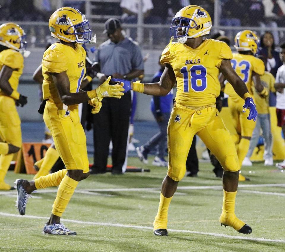 Northwestern Bulls wide receiver Kahlil Brantley (18) celebrates with teammate Romello Brinson (1) after a touchdown against Tampa Jesuit Tigers during the 5A state semifinal football game on Friday, November 29, 2019 at Traz Powell stadium in Miami