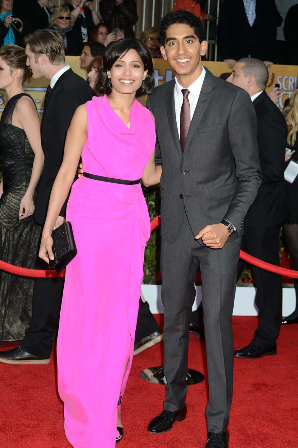 Freida Pinto (L) and Dev Patel arrive at the 19th Annual Screen Actors Guild Awards at the Shrine Auditorium in Los Angeles, CA on January 27, 2013.