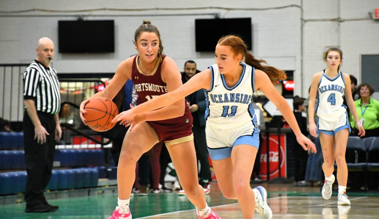 Portsmouth’s Margaret Montplaisir, left, steals the ball from Oceanside’s Aubri Hoose during the Varsity Maine Holiday Hoops Showcase Thursday at the Portland Expo.