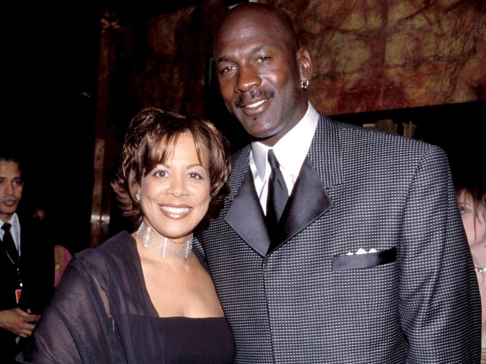 <p>Kevin Mazur/WireImage</p> Michael Jordan and Juanita Vanoy