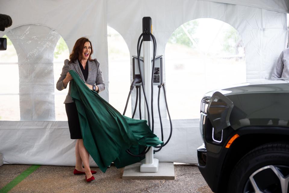 Gov. Gretchen Whitmer unveils the new electric charging stations for Michigan State Parks Thursday, May 26, 2022, at Holland State Park. The charging station comes in partnership with EV Manufacturer Rivian, Adopt-a-Charger and the State of Michigan.