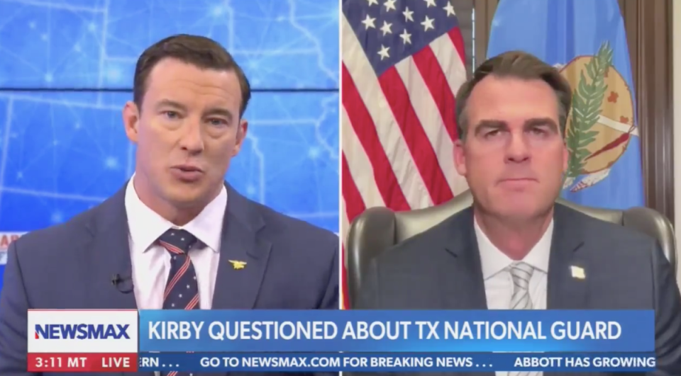 Newsmax has come under fire after airing a segment in which the channel’s host Carl Higbie (left) and Oklahoma Governor Kevin Stitt discussed a potential “force-on-force” conflict between the south and the Biden Administration (Newsmax)