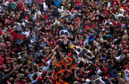 FILE PHOTO: Former Brazilian President Luiz Inacio Lula da Silva is carried by supporters in front of the metallurgic trade union in Sao Bernardo do Campo, Brazil, April 7, 2018. REUTERS/Francisco Proner/File Photo