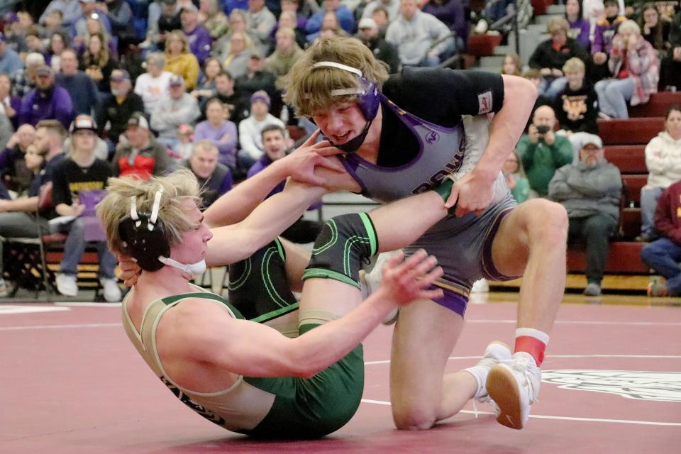 Watertown's Ian Johnson (right) takes down Sioux Falls Jefferson's Nolan Jessen during their 152-poudn championship match in the Region 1A wrestling tournament on Saturday, Feb. 18, 2023 at Madison. Johnson won byh fall.