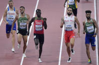 Mostafa Smaili, of Morocco, Wesley Vázquez, of Puerto Rico, and Emmanuel Kipkurui Korir, of Kenya, from right, compete in a men's 800 meter race heat during the World Athletics Championships in Doha, Qatar, Saturday, Sept. 28, 2019. (AP Photo/Martin Meissner)