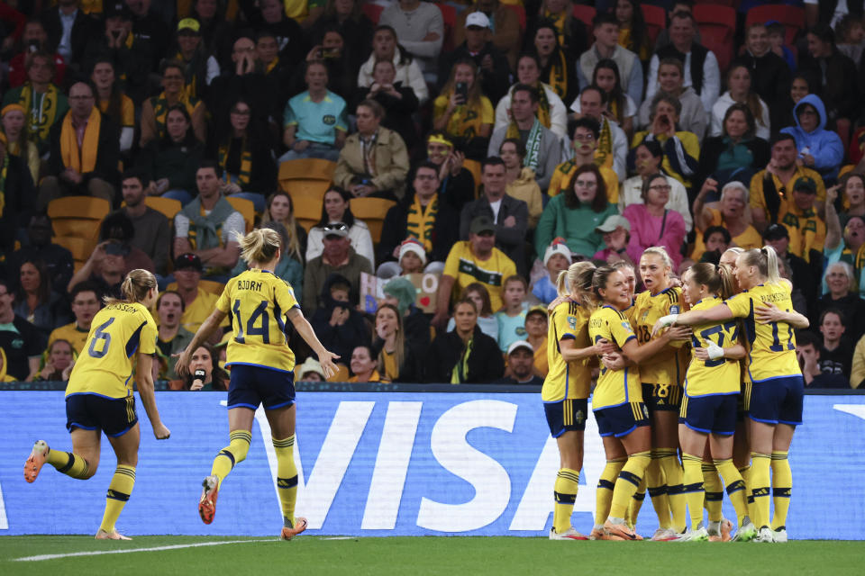 Sweden celebrate after scoring their first goal during the Women's World Cup third place playoff soccer match between Australia and Sweden in Brisbane, Australia, Saturday, Aug. 19, 2023. (AP Photo/Tertius Pickard)