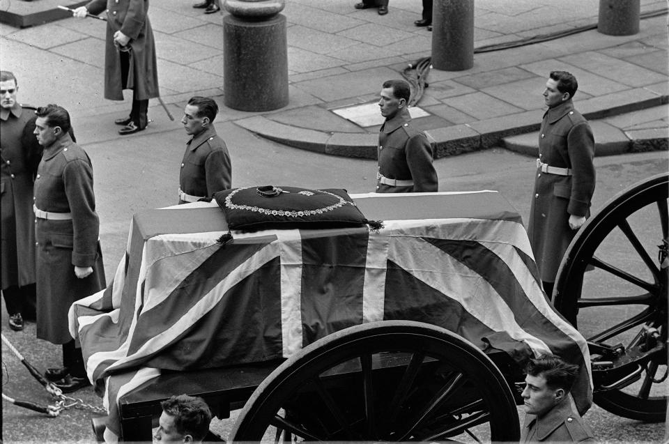 state funeral Resting on a gun carriage drawn by Naval gun crews, the flag draped coffin of Sir Winston Churchill passes the Houses of Parliament at the start of the solemn state funeral procession to St. Paul's Cathedral, London, Jan. 30, 1965. On top of the coffin is Sir Winston Churchill's collar of the Order of the Garter. (AP Photo)