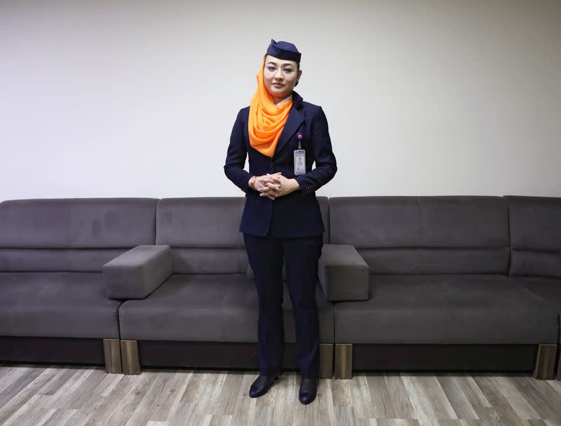 Shagufa Haidary, 23, Kam Air flight attendant, poses for a photo after an interview in Kabul