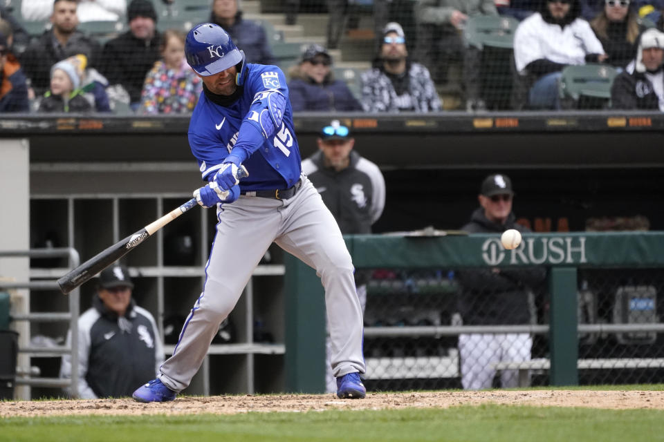 Kansas City Royals' Whit Merrifield hits an RBI single off Chicago White Sox's Dylan Cease during the sixth inning of a baseball game Wednesday, April 27, 2022, in Chicago. (AP Photo/Charles Rex Arbogast)