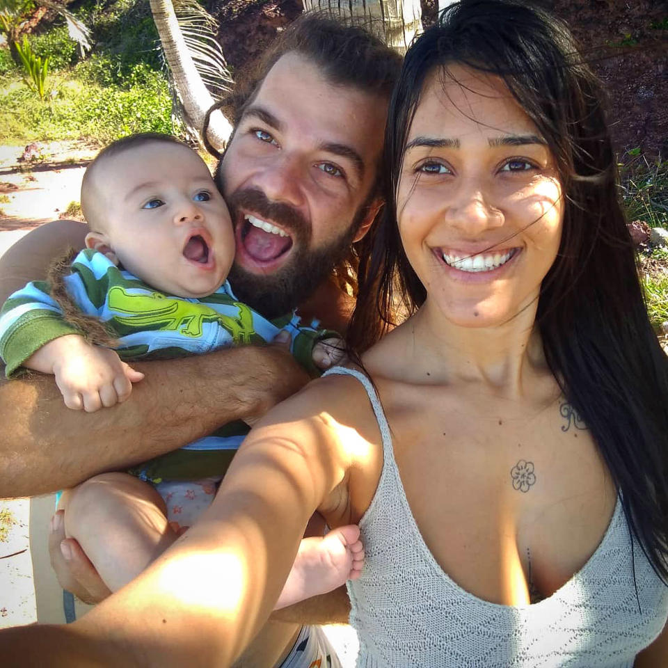 Stela Silva de Souza takes a selfie with her husband, Hugo Mendes Pereira, and their seven-month-old son.