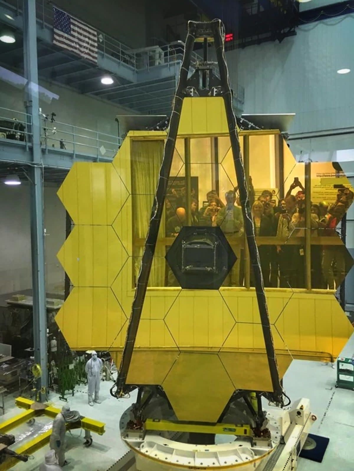 Visitors view the primary mirror of the James Webb Space Telescope in 2017 in the Nasa Goddard Space Flight Center clean room.  (Nasa)