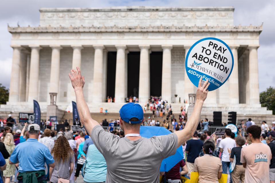 Anti-abortion-rights activists participate in a Celebrate Life Day Rally at the Lincoln Memorial on June 24 in Washington, D.C. The rally, organized by anti-abortion-rights organizations, was held to commemorate the first anniversary of the Dobbs v. Jackson Women's Health Organization Supreme Court decision, which reversed abortion rights established by Roe v. Wade.