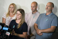 Nichole Schmidt, mother of Gabby Petito, whose death on a cross-country trip has sparked a manhunt for her boyfriend Brian Laundrie, speaks alongside, from left, Tara Petito, stepmother, Jim Schmidt, stepfather, and Joseph Petito, father, during a news conference, Tuesday, Sept. 28, 2021, in Bohemia, N.Y. (AP Photo/John Minchillo)