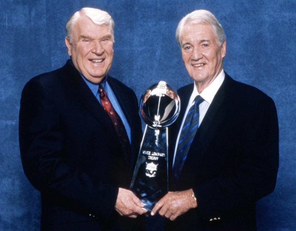 John Madden and Pat Summerall with the Lombardi Trophy from Super Bowl in 1997