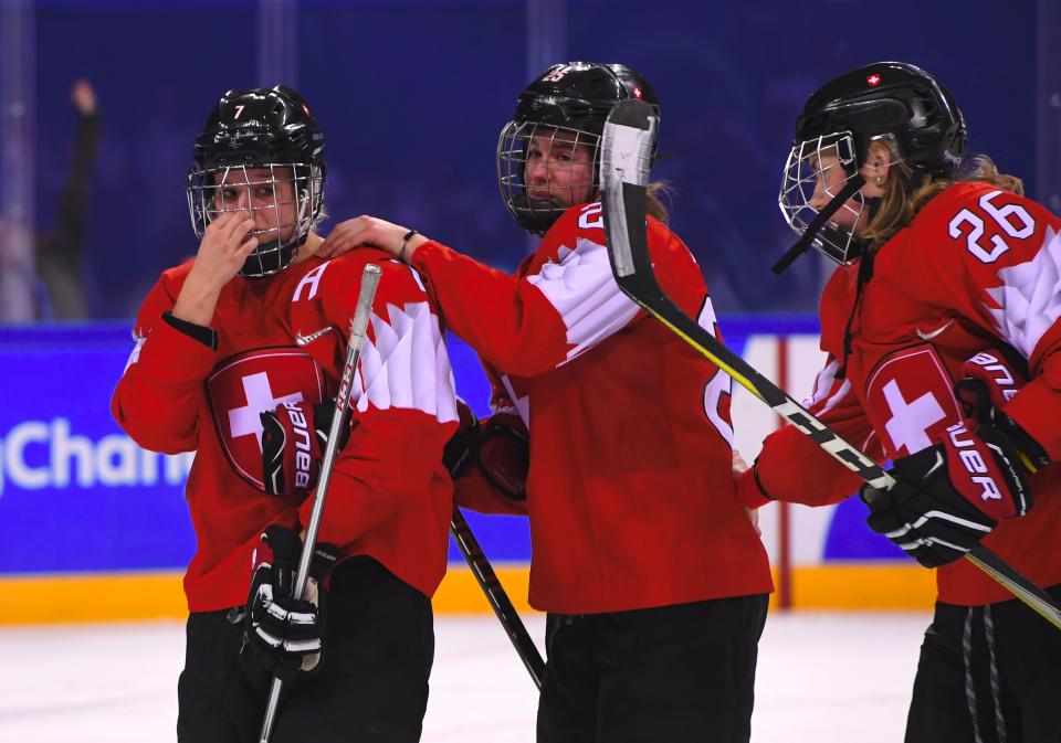 <p>Switzerland players stand on the ice after their defeat in the women’s quarter-final ice hockey match between the Olympic Athletes from Russia and Switzerland during the Pyeongchang 2018 Winter Olympic Games at the Kwandong Hockey Centre in Gangneung on February 17, 2018. / AFP PHOTO / Jung Yeon-je </p>