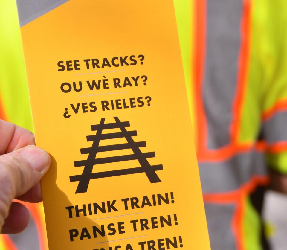 Melbourne police officers, members of the Brightline safety and security team and Florida East Coast Railway Society members were out on New Haven Avenue in downtown Melbourne Friday afternoon, passing out safety information on train crossings.