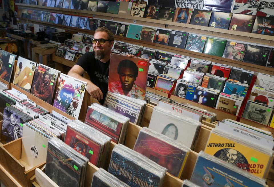 Todd Brewer, former co-owner of Rainbow Records with his wife, Miranda, at the Newark institution's new location in Pomeroy Station a few blocks up Main Street from its former spot.