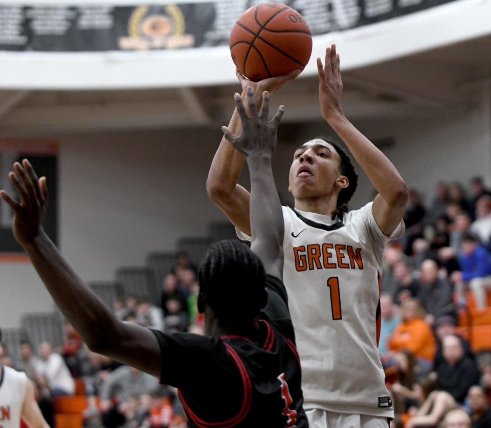Green's Jarrett Taylor scores in the fourth quarter of McKinley at Green boys basketball. Friday, February 09, 2024.