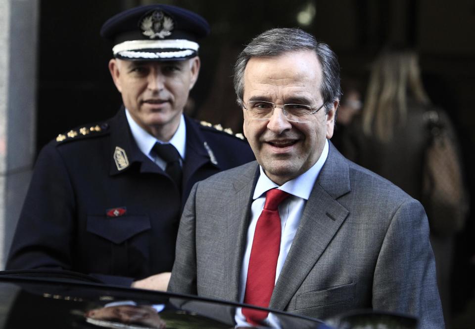 Greece's Prime Minister Antonis Samaras leaves the Finance Ministry after a meeting on cutting red tape for businesses in Athens, Monday, Feb. 17, 2014. Samaras has said that after years of deficits, Greece will post a euro1.5 billion ($ 2 billion) primary surplus in 2013, and in 2014 the country is expected to return to growth after a six-year recession. But unemployment remains at record high levels, reaching a staggering 28 percent in November. (AP Photo/Thanassis Stavrakis)