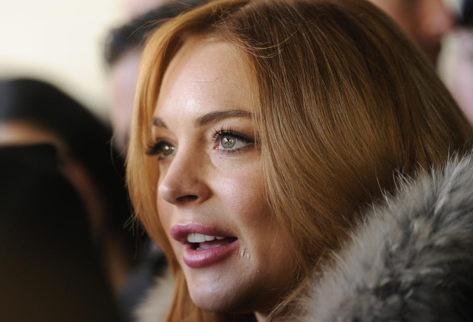 Actress Lindsay Lohan is interviewed following a news conference at the 2014 Sundance Film Festival, Monday, Jan. 20, 2014, in Park City, Utah. Producer Randall Emmett and Lohan announced the forthcoming production of a new film, "Inconceivable," in which Lohan will star and co-produce. (Photo by Chris Pizzello/Invision/AP)