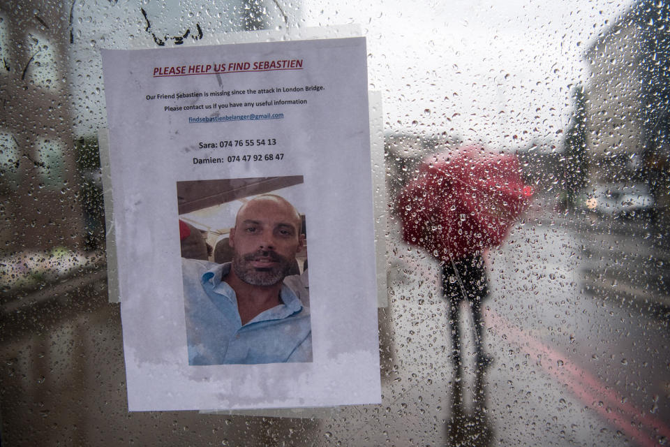 A missing person notice is placed in a bus stop on London Bridge