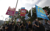 Protesters wearing face masks shout slogans during a rally to demand the peace on the Korean peninsula and to stop sanctions against North Korea in front of Foreign Ministry upon U.S. Deputy Secretary of State Stephen Biegun's arrival to meet with South Korean officials in Seoul, South Korea, Wednesday, July 8, 2020. Biegun arrived on Tuesday in the country on the first leg of his two-stop Asia trip and will meet officials in South Korea and Japan. (AP Photo/Lee Jin-man)