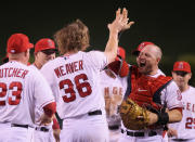 ANAHEIM, CA - MAY 02: Starting pitcher Jered Weaver #36 of the Los Angeles Angels of Anaheim celebrates with catcher Chris Iannetta (R) #17 and the rest of his teammates after throwing a no-hitter against the Minnesota Twins at Angel Stadium of Anaheim on May 2, 2012 in Anaheim, California. The Angels defeated the Twins 9-0. (Photo by Jeff Gross/Getty Images)