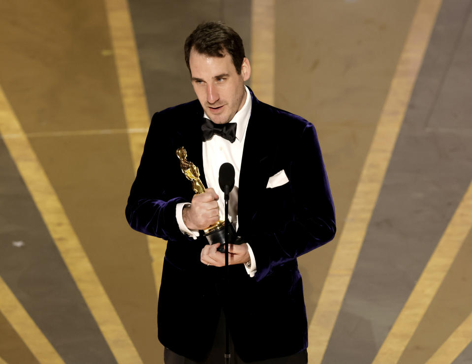 James Friend accepts Best Cinematography for All Quiet on the Western Front during the Academy Awards on March 12.