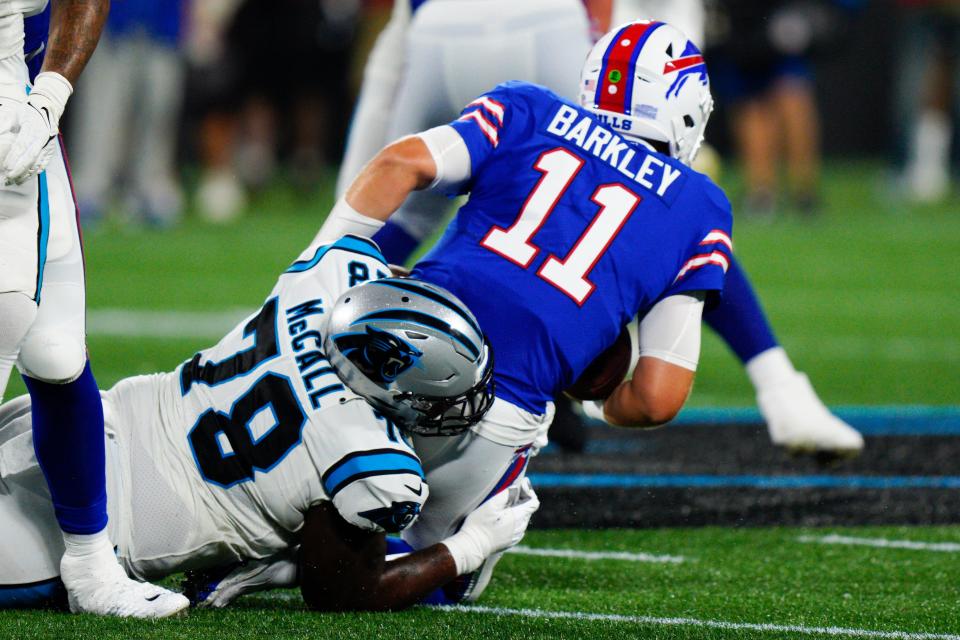 Carolina Panthers defensive tackle Marquan McCall sacks Buffalo Bills quarterback Matt Barkley during the second half of an NFL preseason football game on Friday, Aug. 26, 2022, in Charlotte, N.C. (AP Photo/Jacob Kupferman)