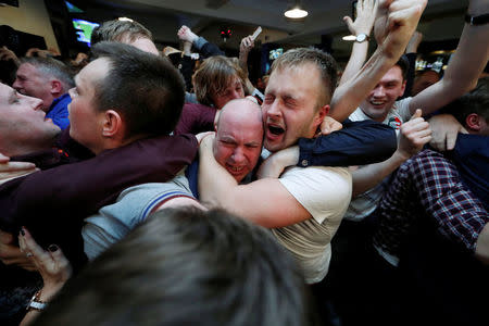 Britain Football Soccer - Leicester City fans watch the Chelsea v Tottenham Hotspur game in pub in Leicester - 2/5/16. Leicester City fans celebrate winning the Premier League. Reuters/ Eddie Keogh Livepic