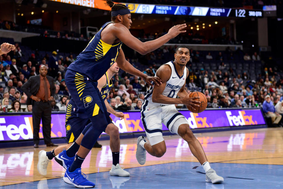 Memphis Grizzlies guard De'Anthony Melton (0) handles the ball against Indiana Pacers center Myles Turner in the second half of an NBA basketball game Monday, Dec. 2, 2019, in Memphis, Tenn. (AP Photo/Brandon Dill)